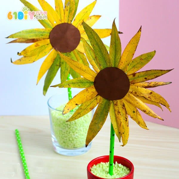 儿童利用树叶手工制作向日葵花朵